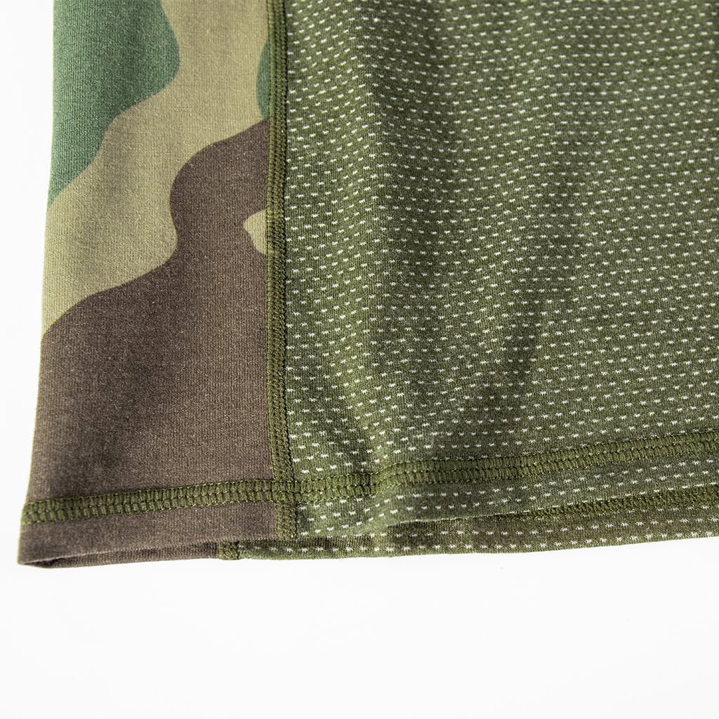 Close-up of the highly breathable mesh fabric on the lower torso of the custom woodland camo G4 combat shirt.