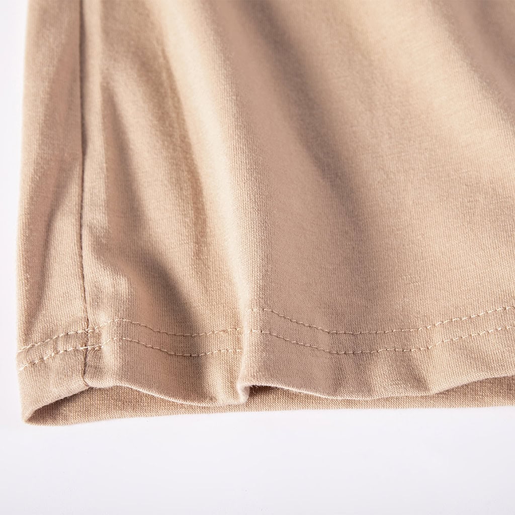 Close-up of the double-stitched hem on the breathable torso of the custom digital desert long sleeve combat shirt.