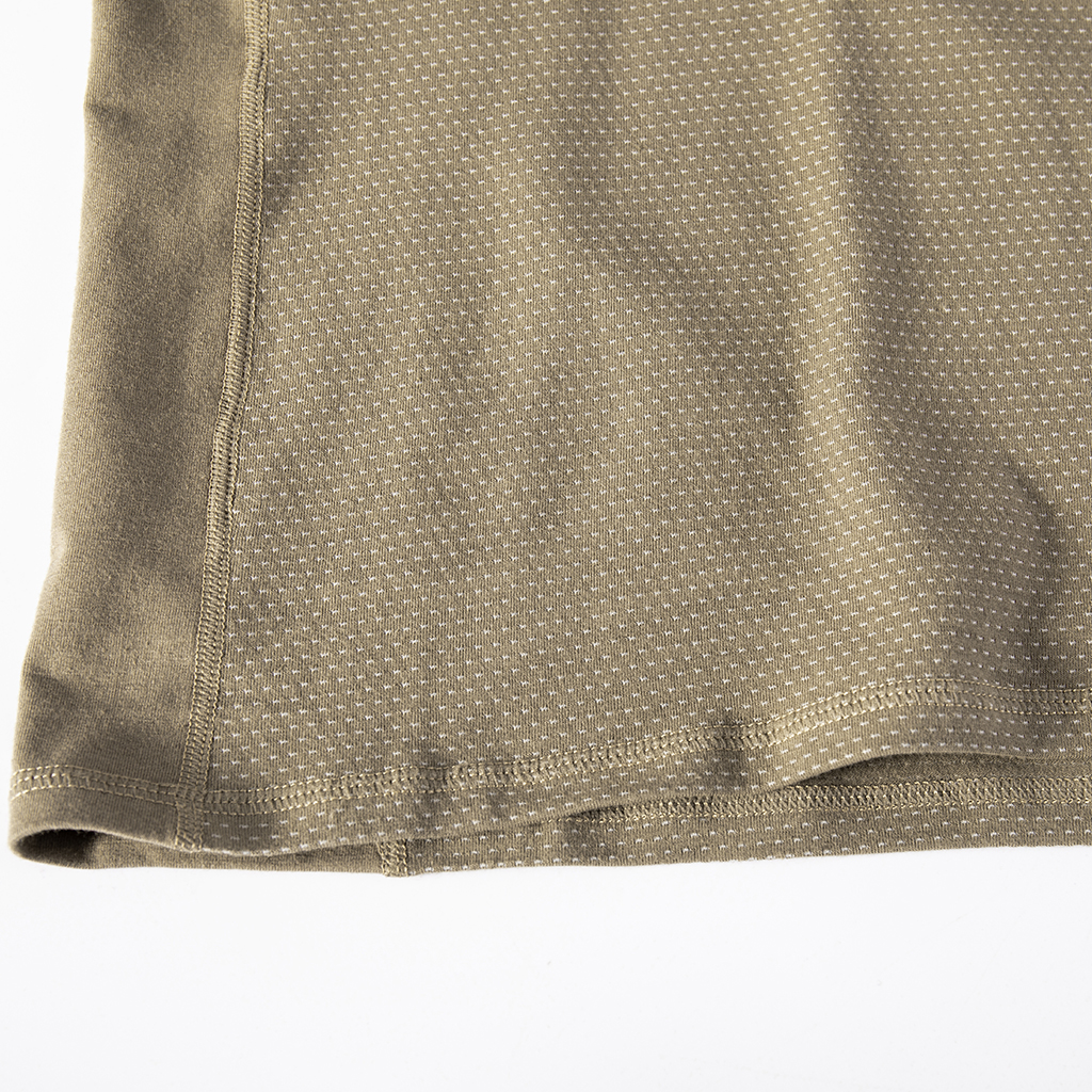 Close-up of the highly breathable mesh fabric on the lower torso of the custom khaki G4 long sleeve combat shirt.