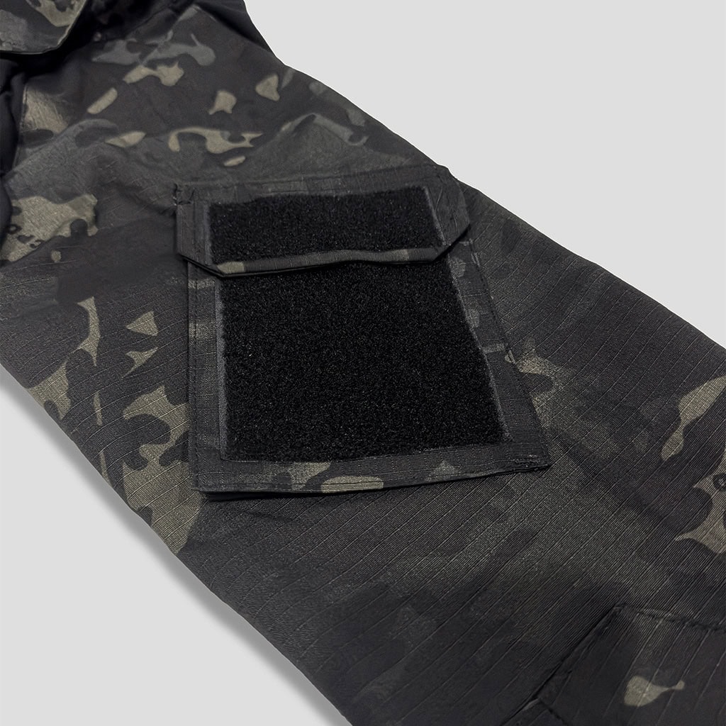 Close-up of the velcro arm pocket on the sleeve of the custom black CP G2 combat shirt.