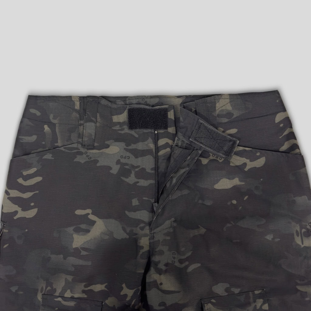 Close-up of the velcro-adjustable waistband on the custom black CP G2 combat uniform trousers.