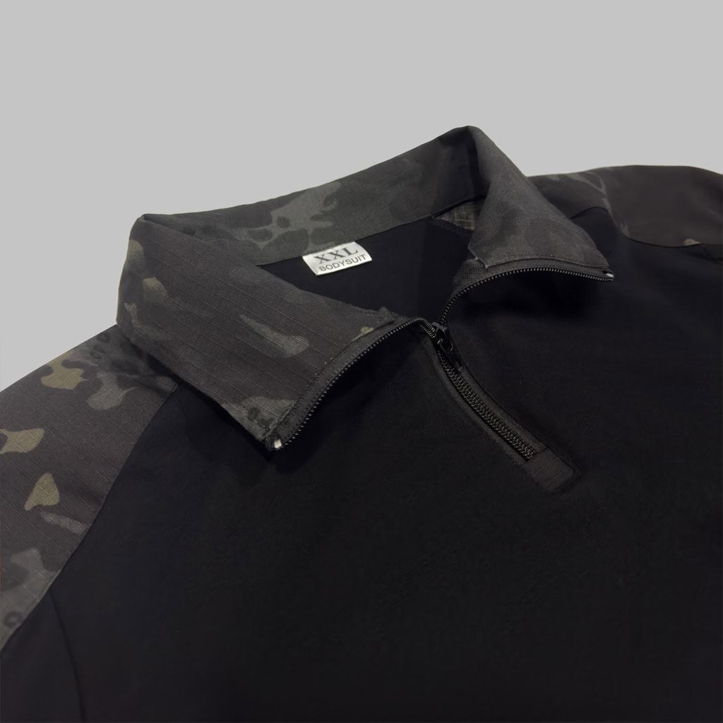 Close-up of the quarter-zip collar on the custom black CP G2 long sleeve combat shirt.