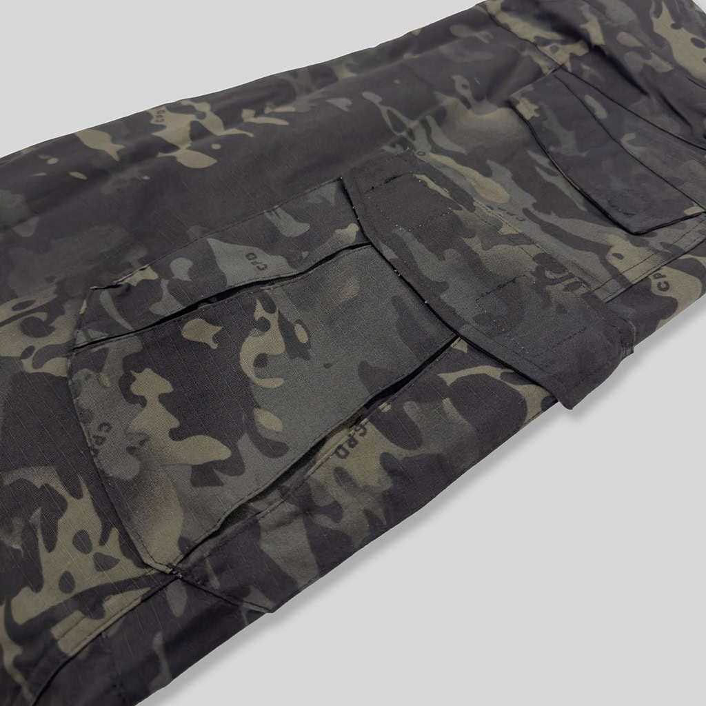 Close-up of the large thigh cargo pocket on the custom black CP G2 combat uniform trousers.