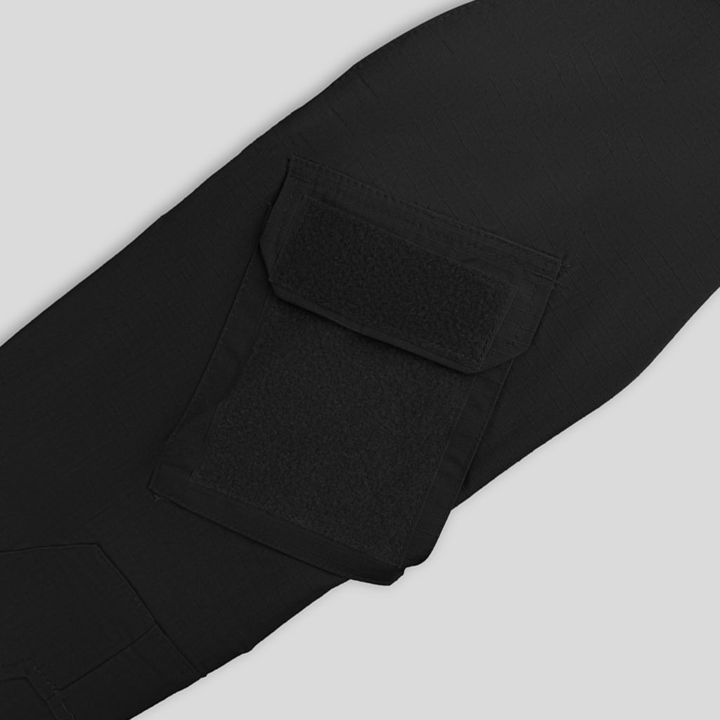 Close-up of the large thigh cargo pocket on the custom black G2 combat uniform trousers.