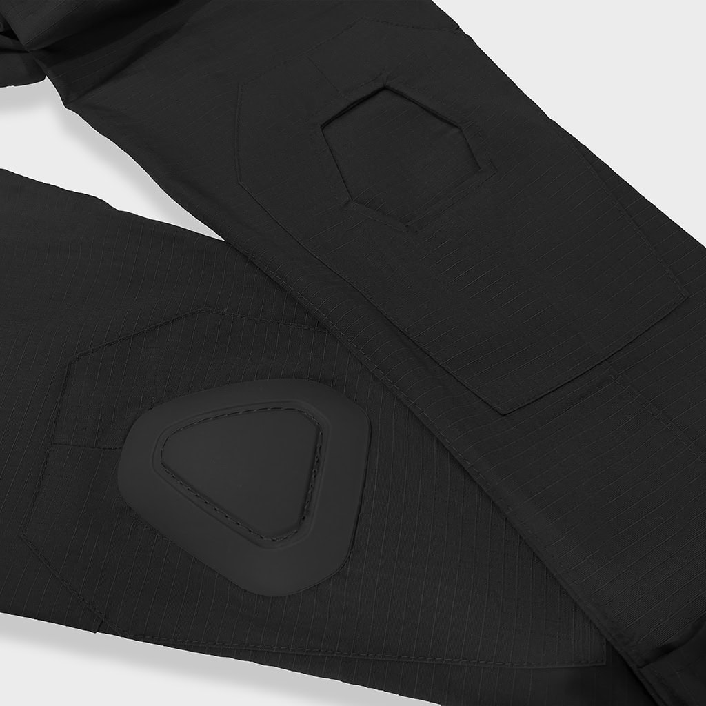 Detail of the integrated knee pad pockets on the custom black G2 combat uniform trousers.