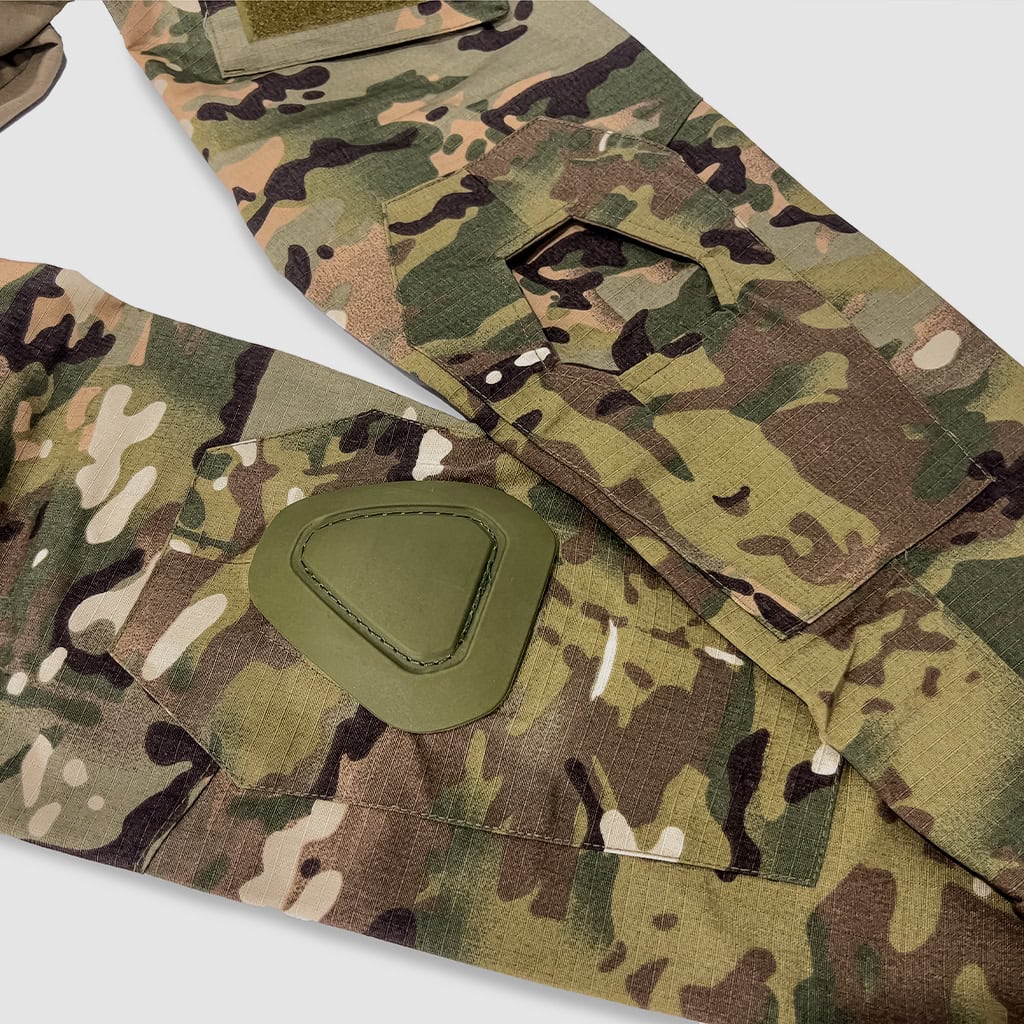 Detail of the integrated elbow pad pocket on the sleeve of the custom CP camo G3 combat shirt.