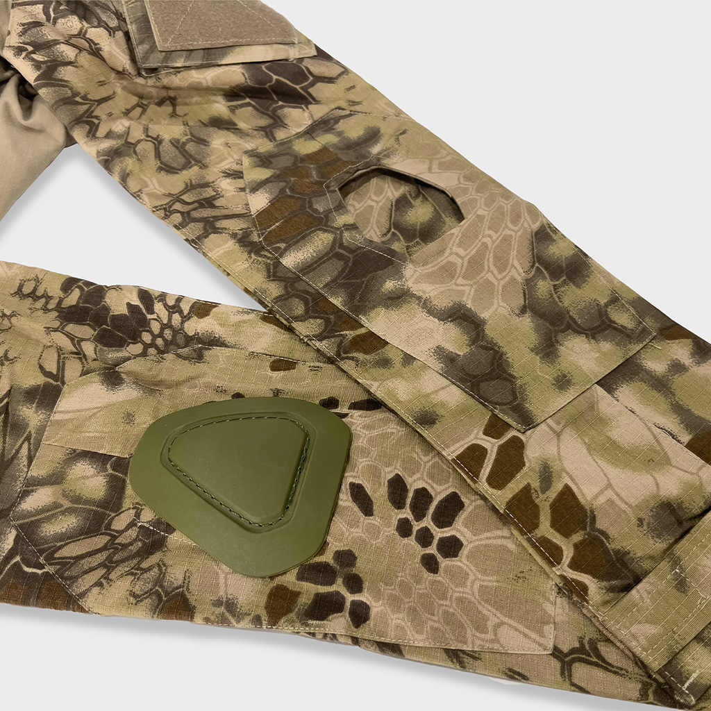 Detail of the integrated elbow pad pocket on the sleeve of the custom python camo G2 combat shirt.