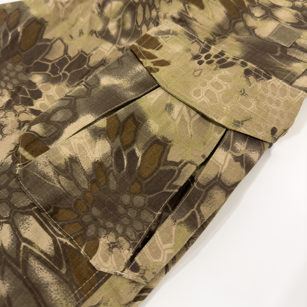 Close-up of the large thigh cargo pocket on the custom python camo G2 combat uniform trousers.