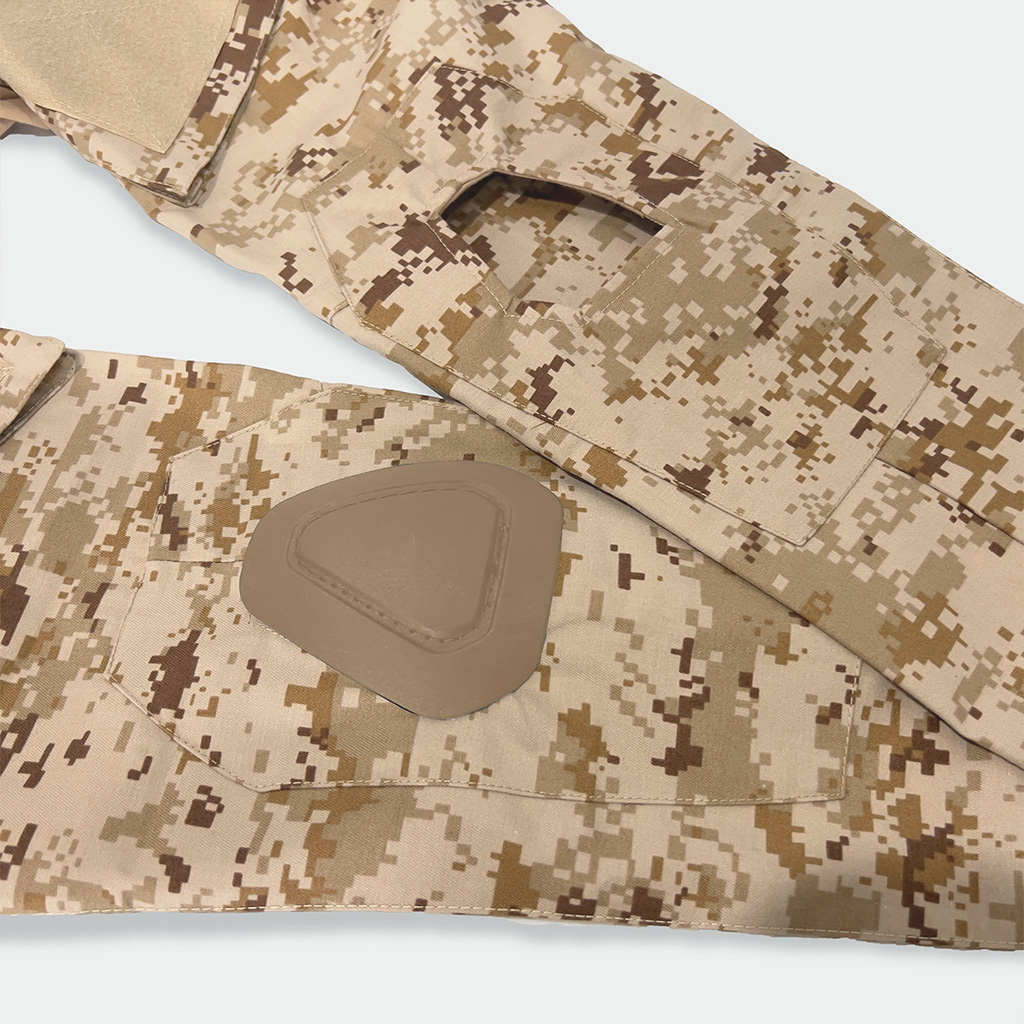 Detail of the integrated elbow pad pocket on the sleeve of the custom digital desert G2 combat shirt.