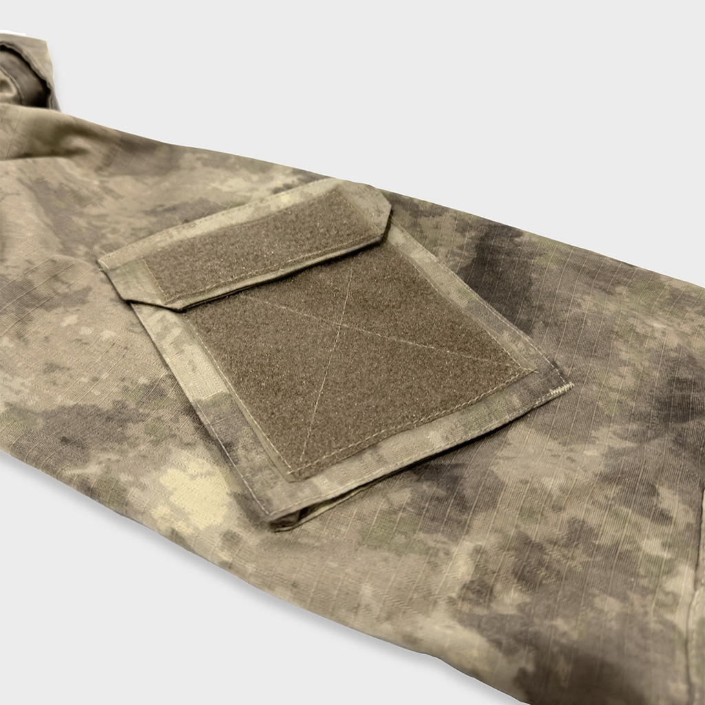 Close-up of the velcro arm pocket on the sleeve of the custom Mali desert camo G2 combat shirt.