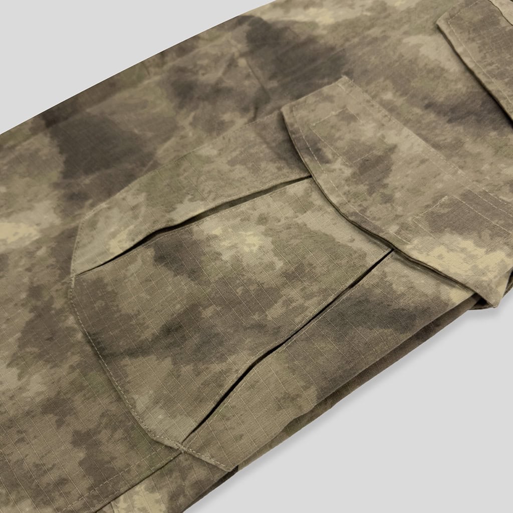 Close-up of the large thigh cargo pocket on the custom Mali desert camo G2 combat uniform trousers.