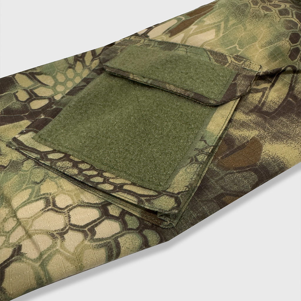 Close-up of the velcro arm pocket on the sleeve of the custom woodland python camo G2 combat shirt.