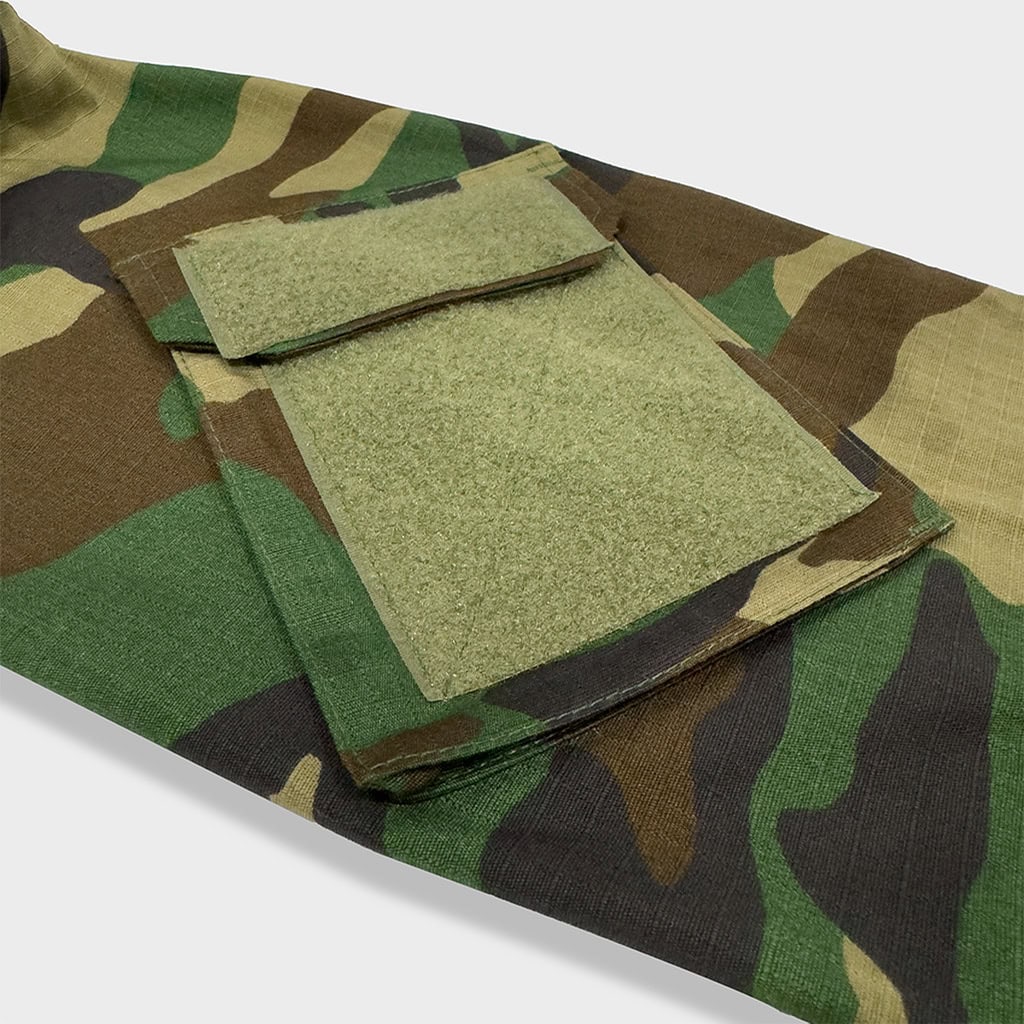 Close-up of the velcro arm pocket on the sleeve of the custom woodland camo G2 combat shirt.
