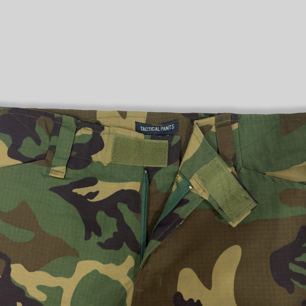 Close-up of the velcro-adjustable waistband on the custom woodland camo G2 combat uniform trousers.