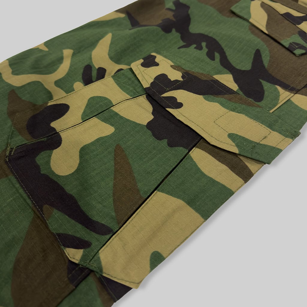 Close-up of the large cargo pocket on the custom woodland camo G2 combat uniform trousers.