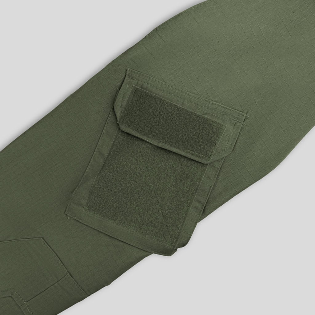 Close-up of the velcro arm pocket on the sleeve of the custom olive green G2 combat shirt.