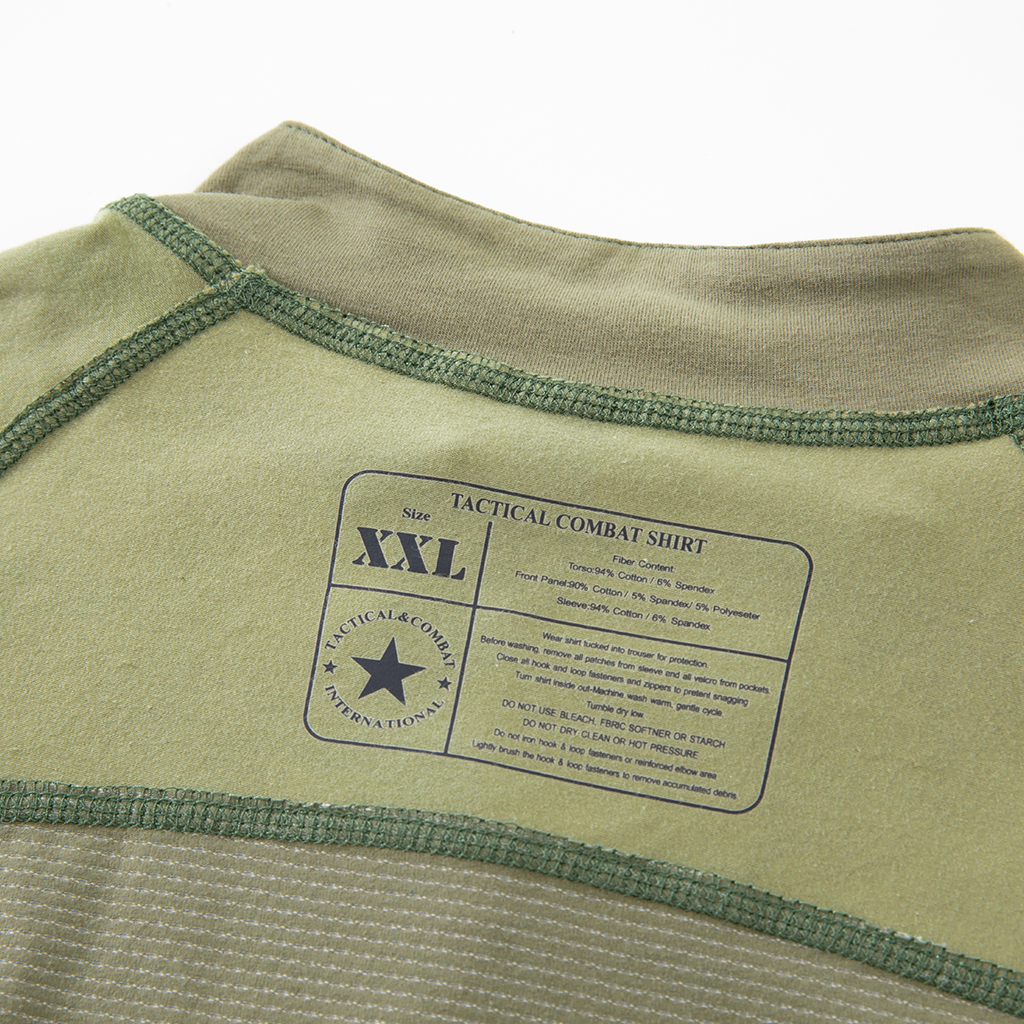 Close-up of the quarter-zip stand-up collar and brand tag on the custom woodland camo G4 short sleeve combat shirt.