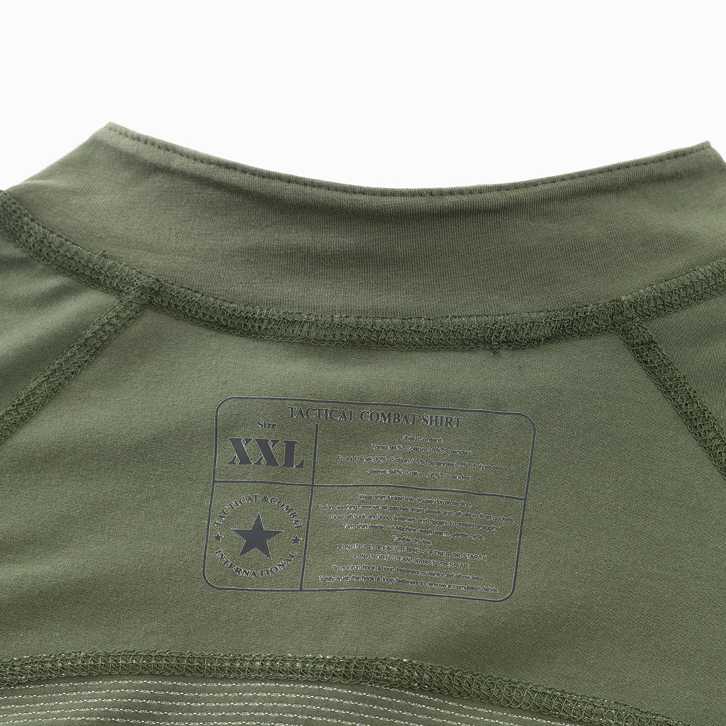 Close-up of the quarter-zip stand-up collar and brand tag on the custom olive green G4 long sleeve combat shirt.