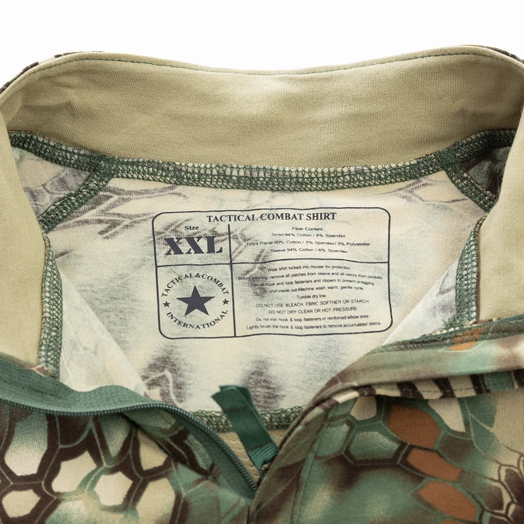 Close-up of the quarter-zip stand-up collar and brand tag on the custom woodland python G4 long sleeve combat shirt.