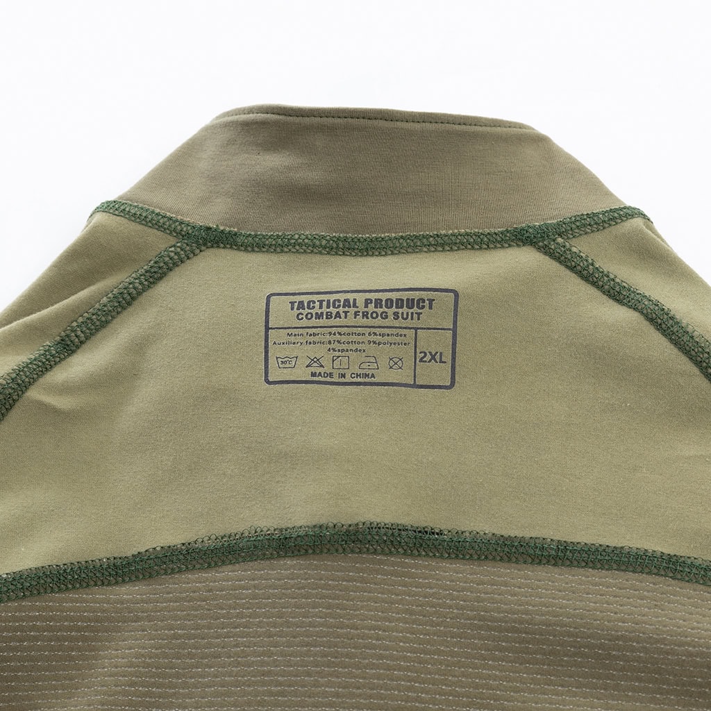 Close-up of the quarter-zip stand-up collar and brand tag on the custom woodland camo G4 long sleeve combat shirt.