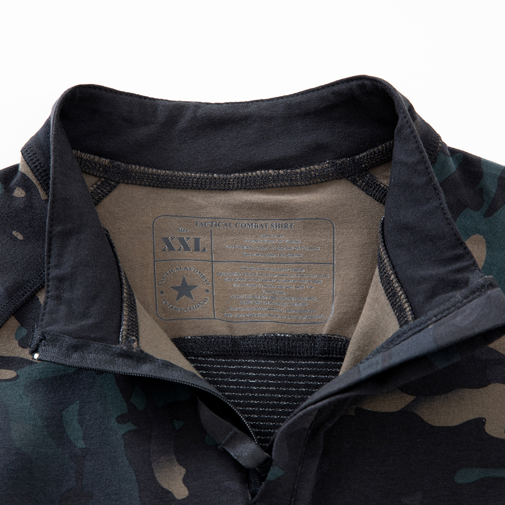 Close-up of the quarter-zip stand-up collar and brand tag on the custom black CP G4 short sleeve combat shirt.