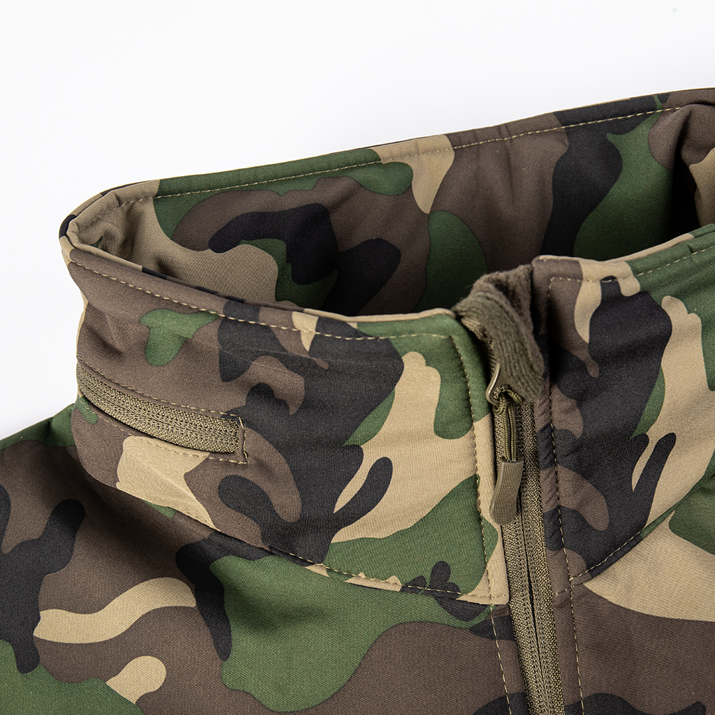 Close-up of the fleece-lined collar and stowable hood compartment on the custom woodland camo softshell jacket.