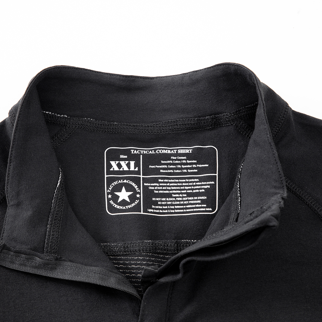 Close-up of the quarter-zip stand-up collar and brand tag on the custom black G4 short sleeve combat shirt.