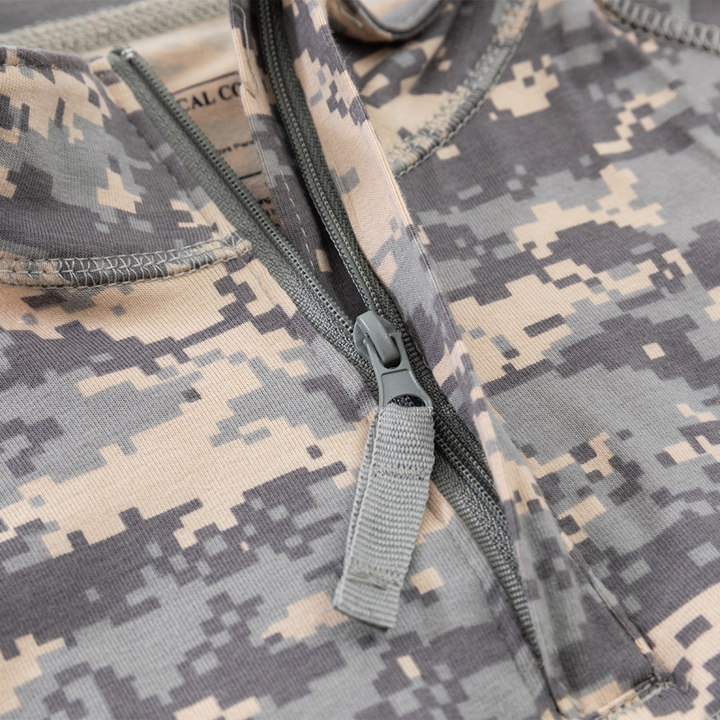 Detail of the premium zipper pull tab at the neckline of the custom ACU G4 long sleeve combat shirt.