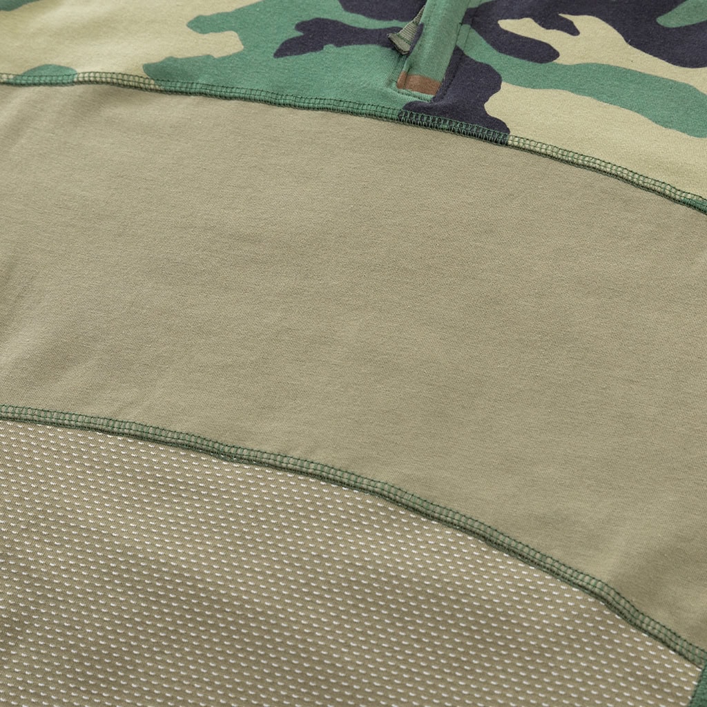 Close-up of the highly breathable mesh fabric on the lower torso of the custom woodland camo G4 long sleeve combat shirt.
