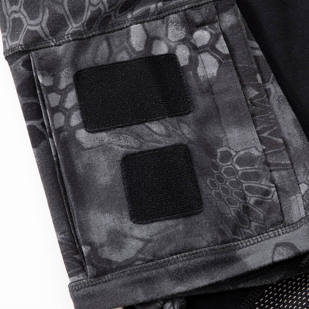 Close-up of the zippered arm pocket with velcro panels on the sleeve of the custom black python G4 combat shirt.