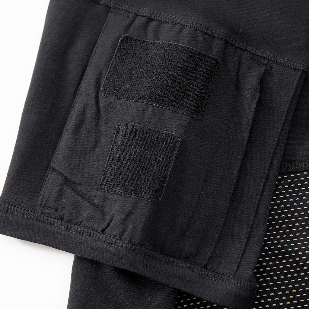 Close-up of the zippered arm pocket with velcro panels on the sleeve of the custom black G4 short sleeve combat shirt.