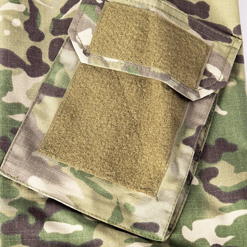 Close-up of the zippered arm pocket with a large velcro panel on the sleeve of the custom CP camo long sleeve combat shirt.