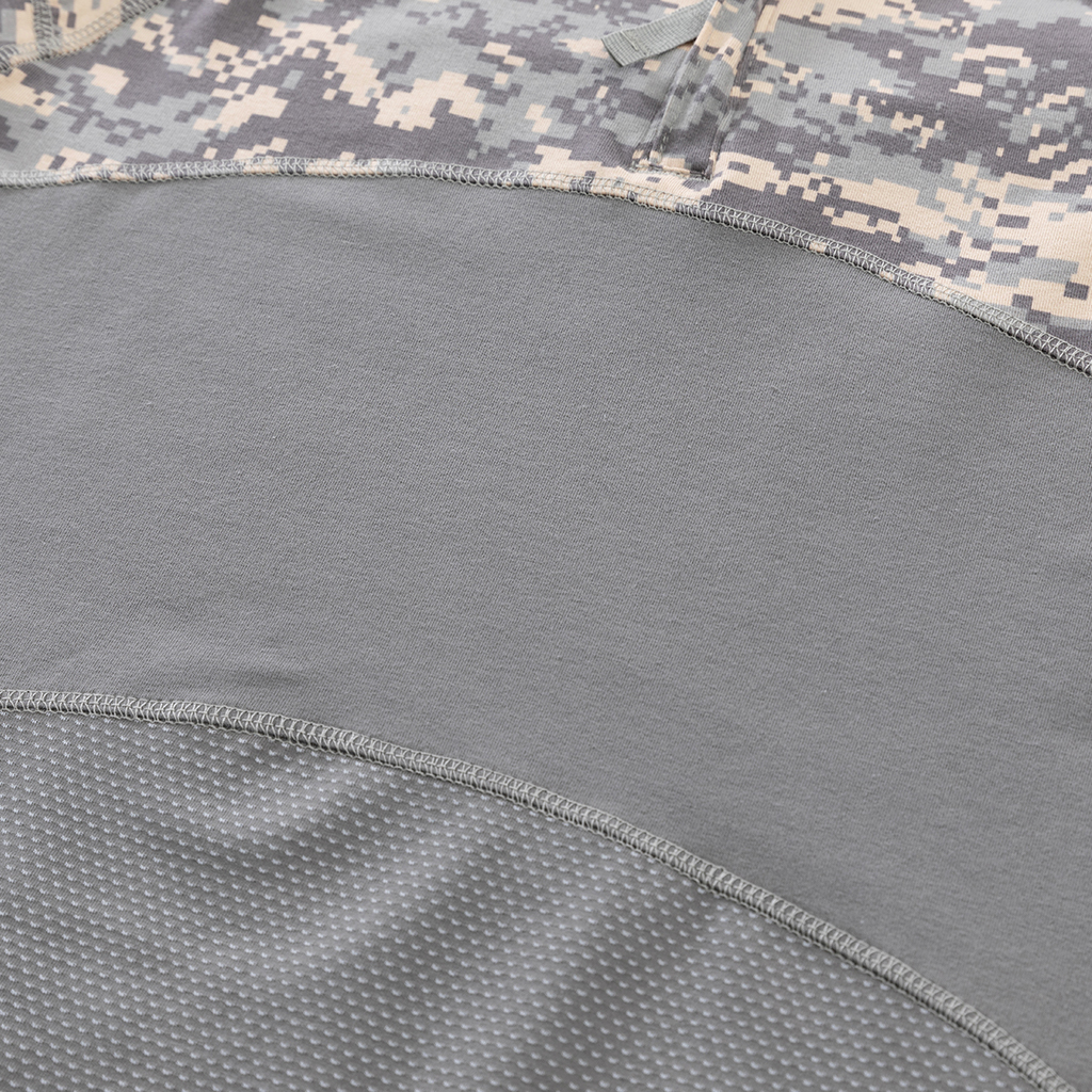 Detail of the highly breathable mesh fabric and reinforced seam on the lower torso of the custom ACU G4 long sleeve combat shirt.