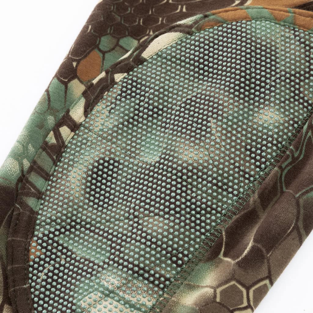 Detail of the integrated anti-slip elbow pad on the sleeve of the custom woodland python G4 long sleeve combat shirt.