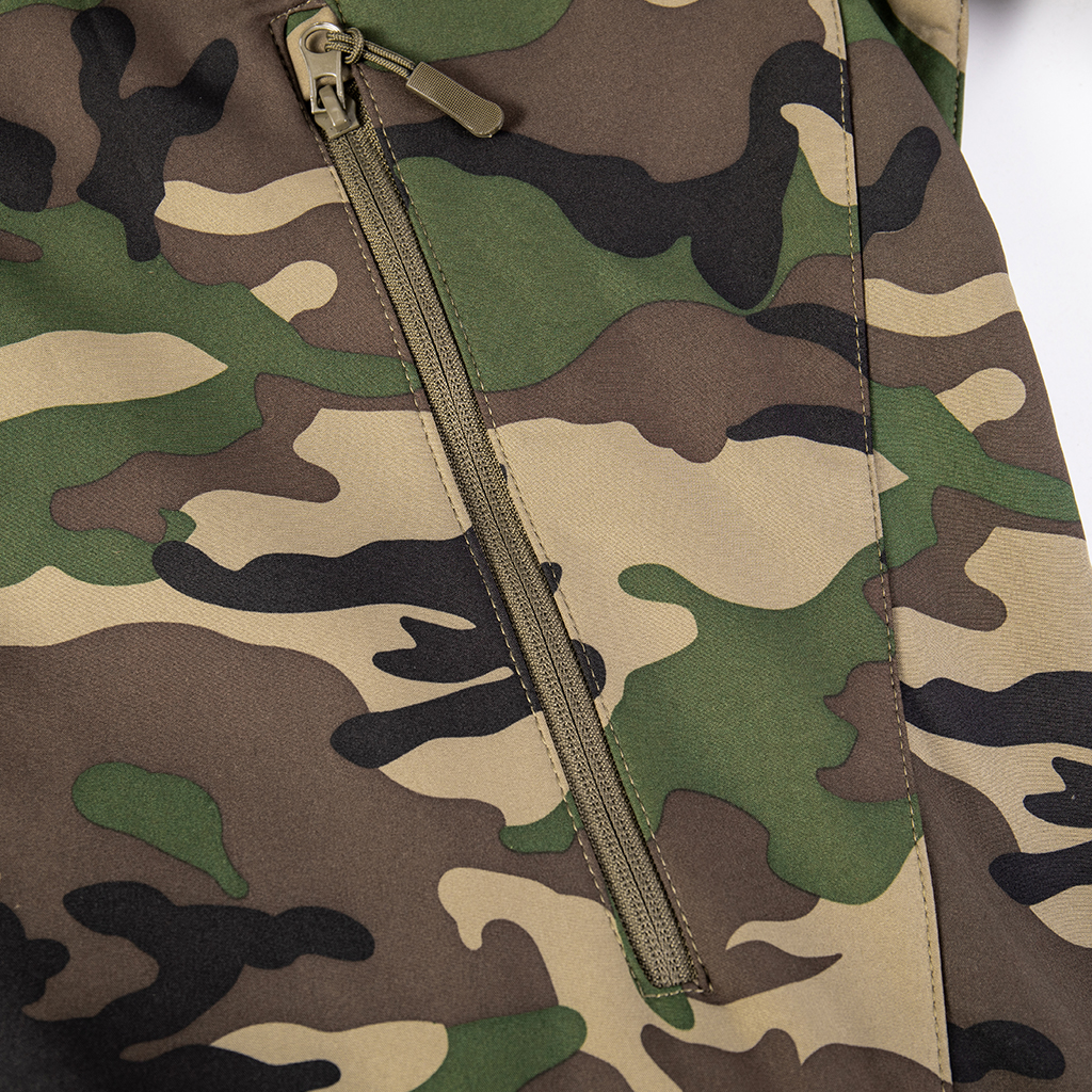 Close-up of the adjustable velcro cuff on the sleeve of the custom woodland camo softshell tactical jacket.