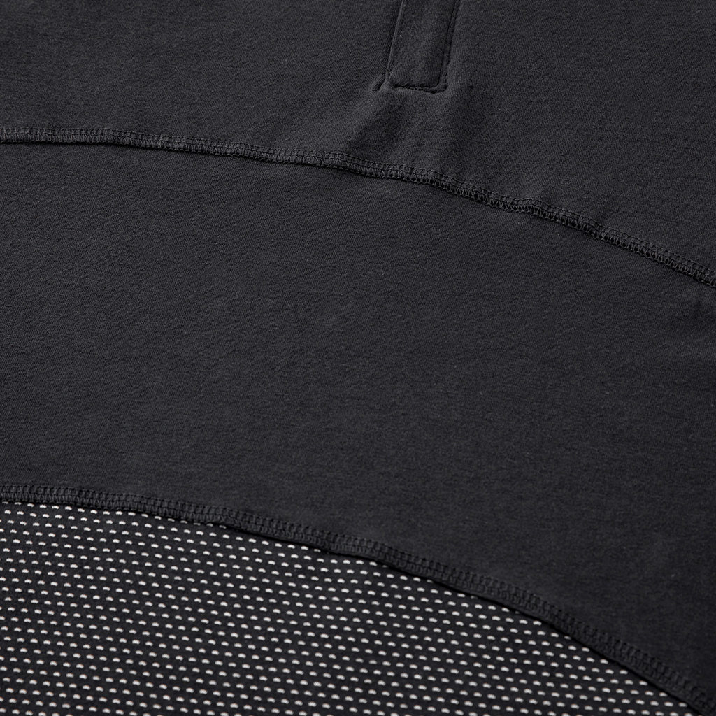 Detail of the highly breathable mesh fabric on the lower torso of the custom black G4 short sleeve combat shirt.