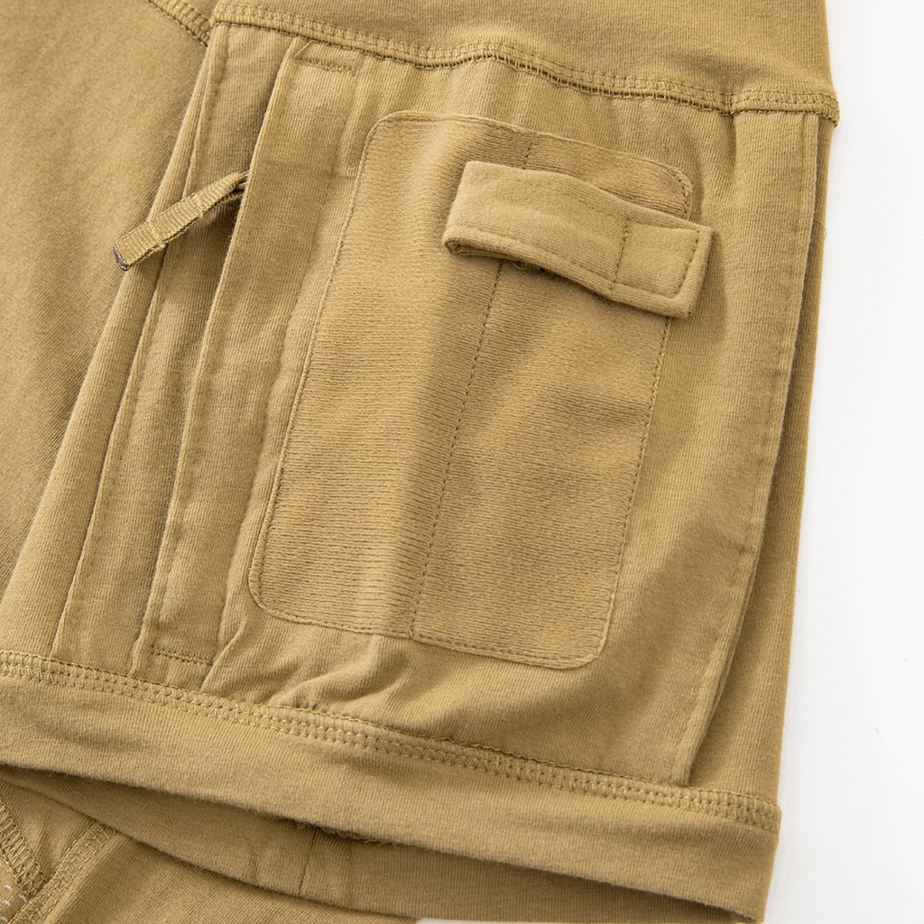 Detail of the zippered arm pocket with pen slots on the sleeve of the custom tan G4 short sleeve combat shirt.