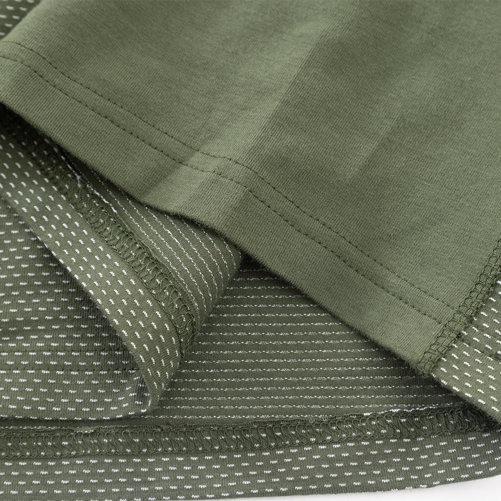 Close-up of the highly breathable mesh fabric on the lower torso of the custom olive green G4 long sleeve combat shirt.