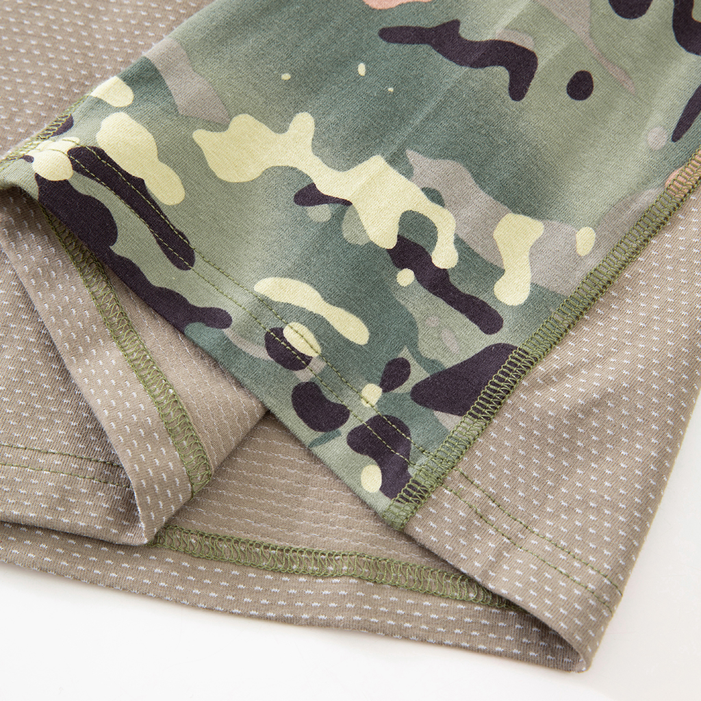 Close-up of the durable hem with locking process stitch on the custom CP camo G4 short sleeve combat shirt.