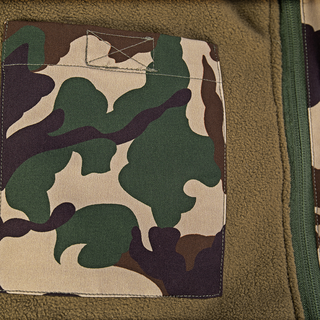 Close-up of an internal pocket on the detachable fleece liner of the custom Nepal camo parka jacket.