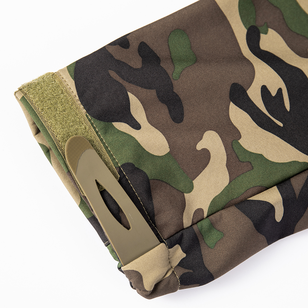 Detail of the durable, water-resistant polyester softshell fabric in classic M81 woodland camouflage.