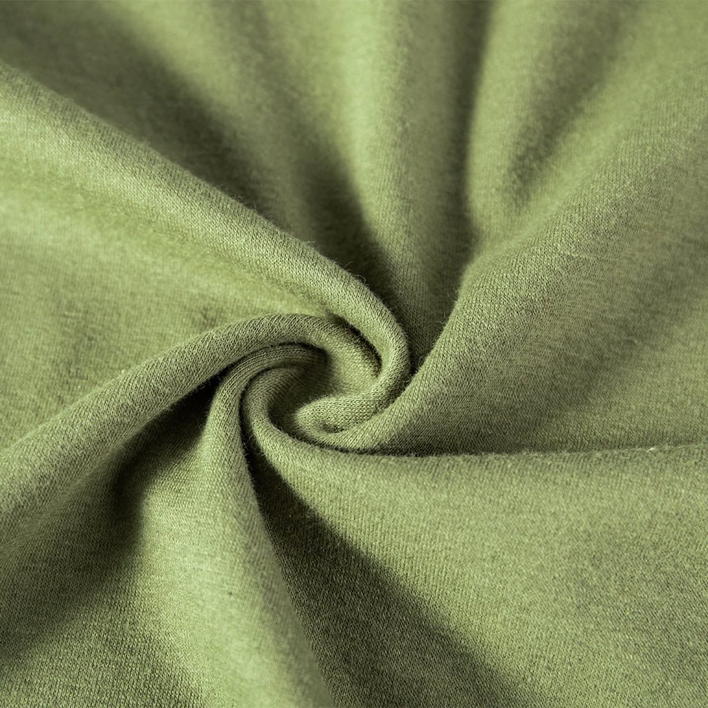 Close-up of the breathable olive drab poly/cotton fabric on the torso of the custom woodland camo short sleeve combat shirt.