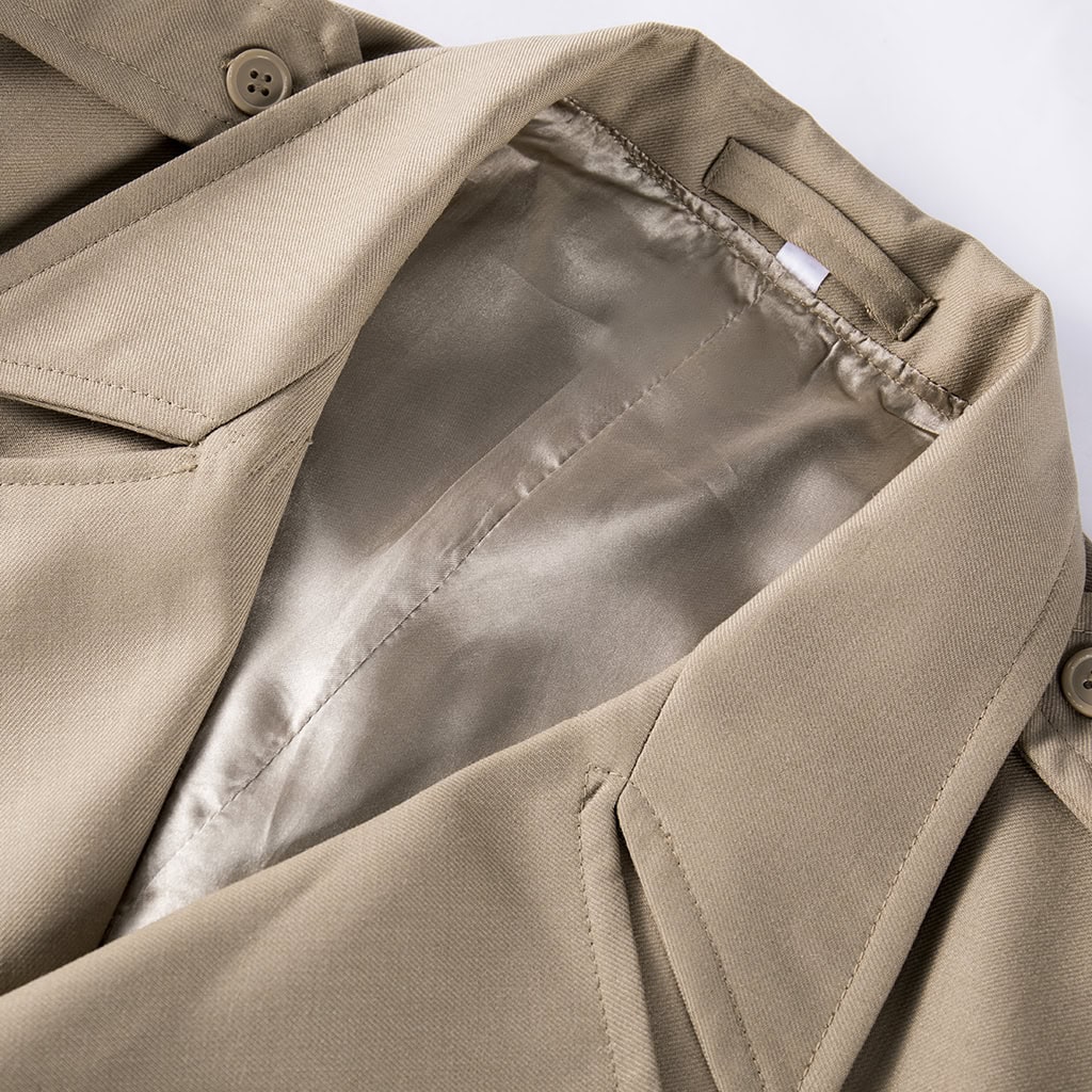 Close-up of the wide lapel collar and smooth nylon lining on the custom khaki military officer trench coat.