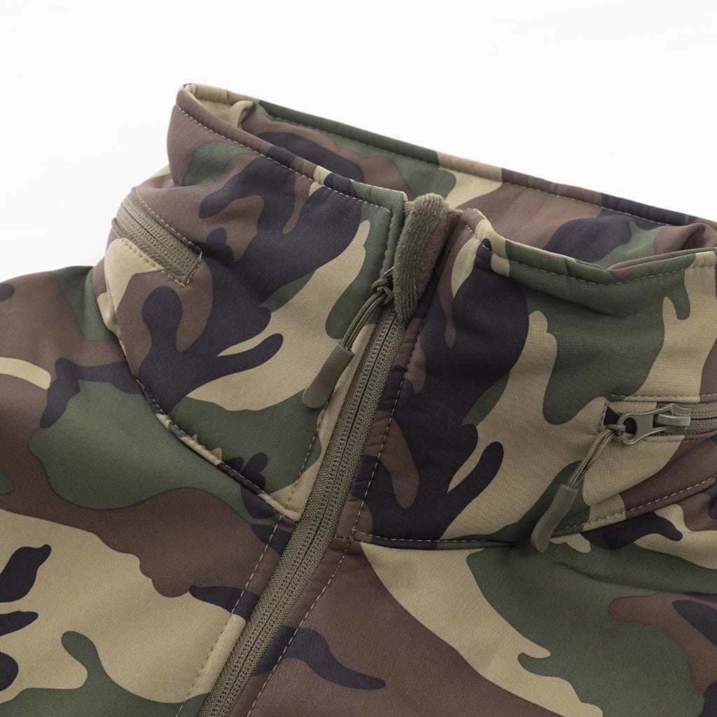 Close-up of the fleece-lined collar and stowable hood compartment on the custom woodland camo softshell jacket.