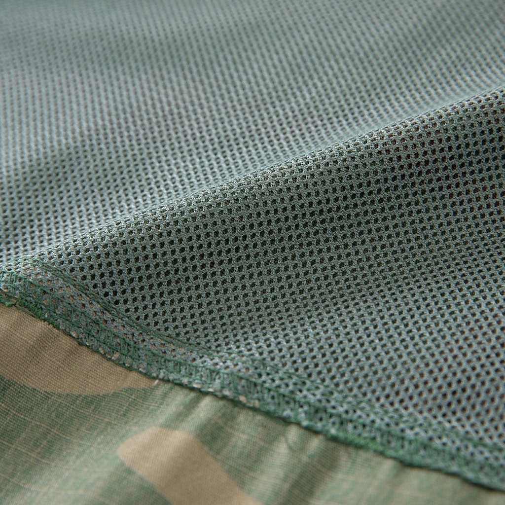 Detail of the breathable mesh panel on the back of the custom woodland camo short sleeve BDU shirt.
