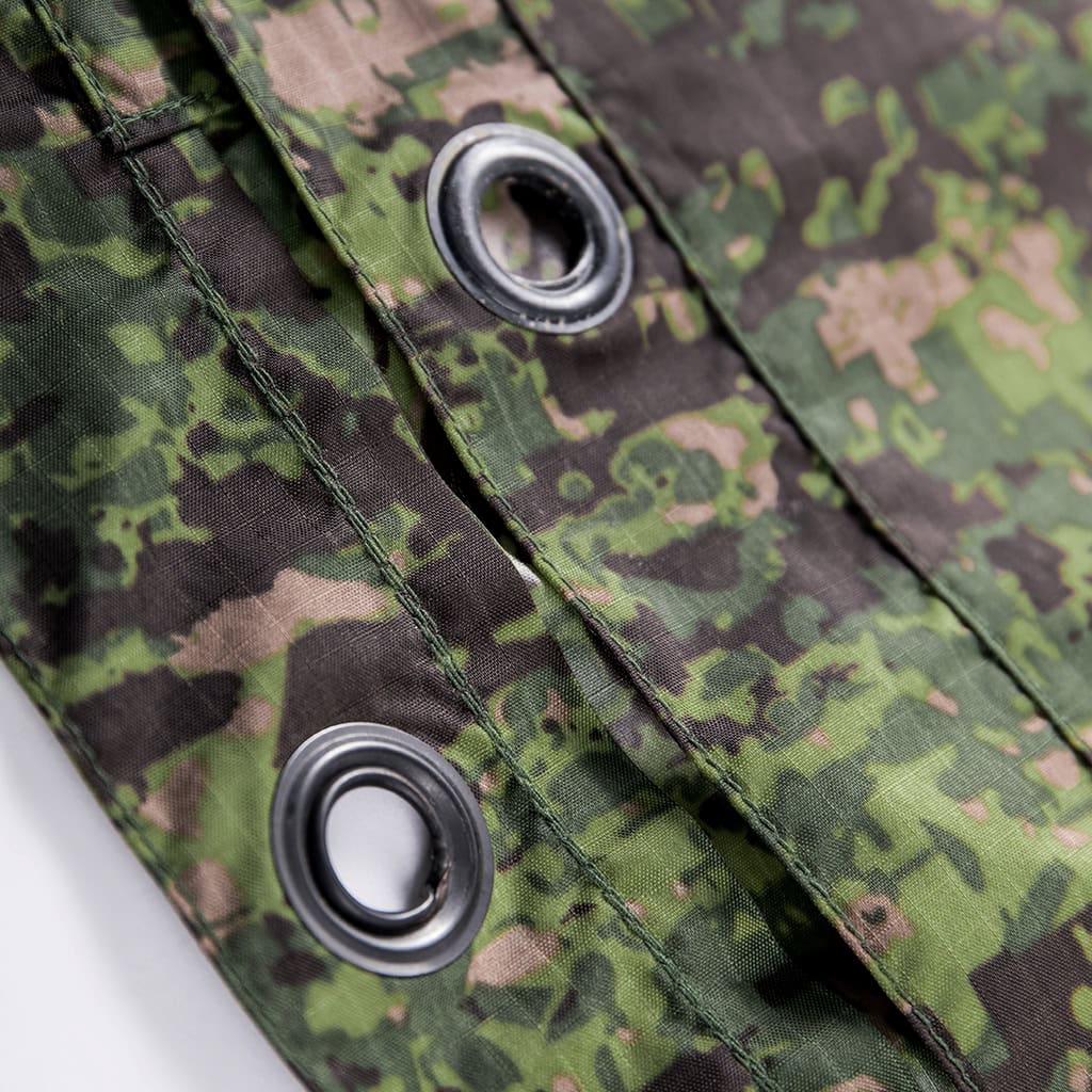 Detail of the durable metal grommet holes on the edge of the custom Philippine jungle camo military poncho.