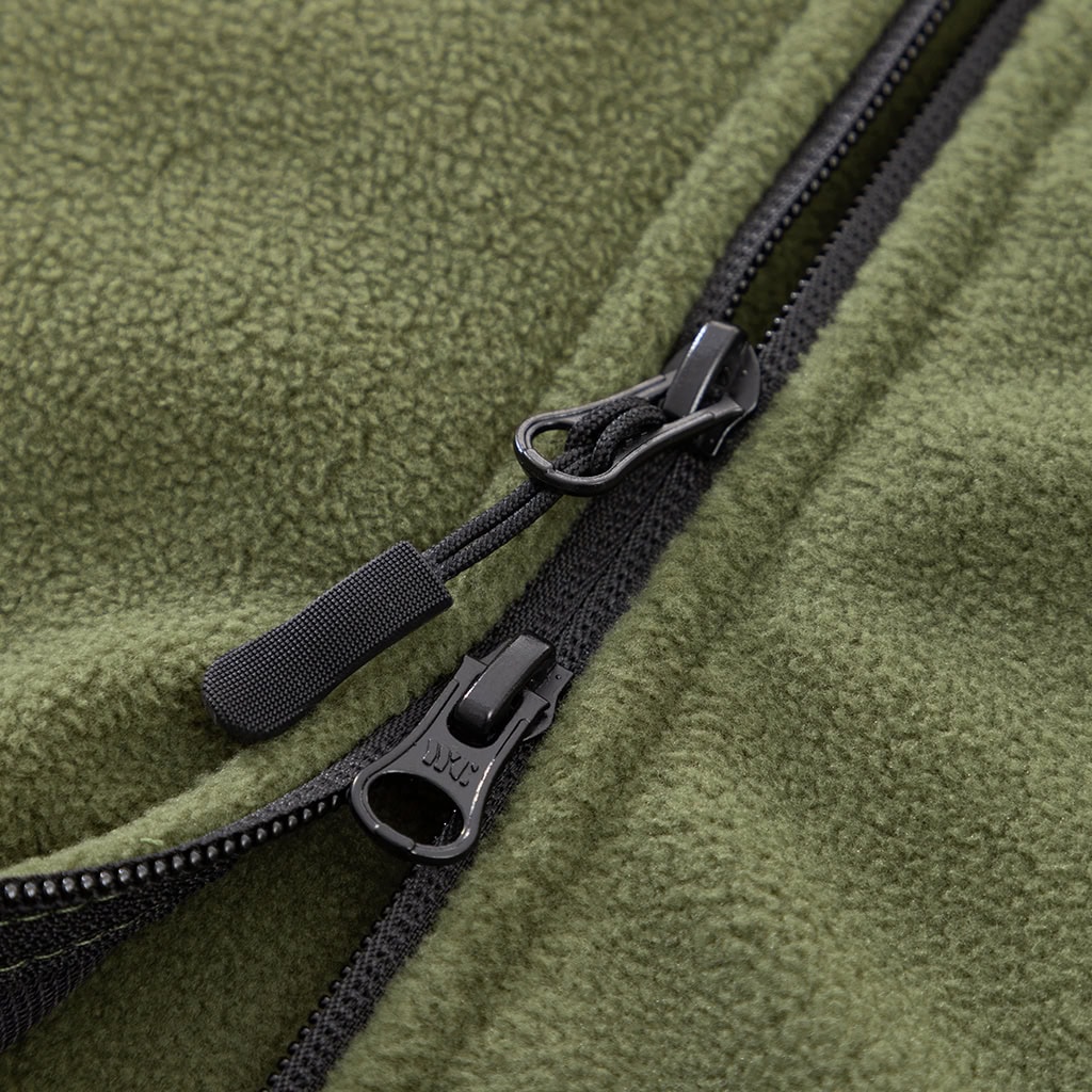 Detail of the heavy-duty two-way front zipper on the custom olive green fleece tactical jacket.