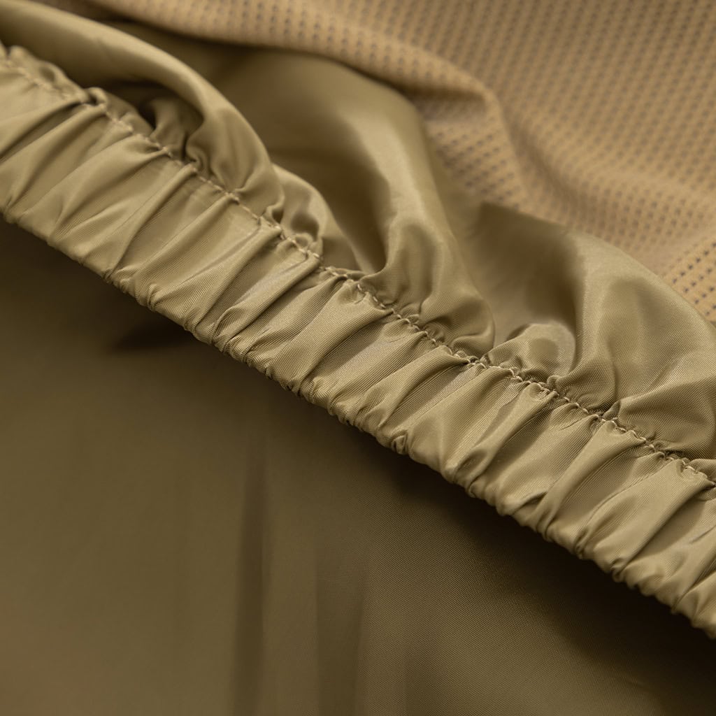 Close-up of the adjustable drawstring at the hem of the custom CP camo M65 style parka jacket.