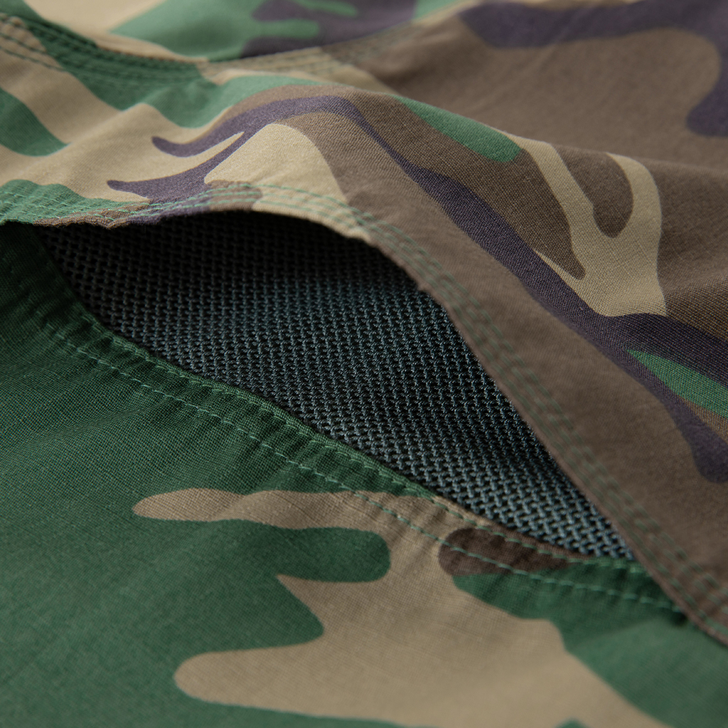 Close-up of the large, button-down bellows chest pocket on the custom woodland camo short sleeve BDU shirt.