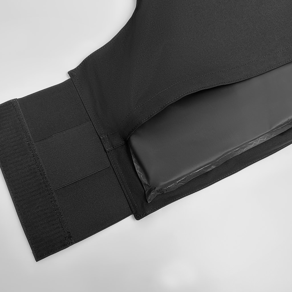 Close-up of the adjustable waist and "Fast Escape" quick-release system on the custom black body armor vest carrier.